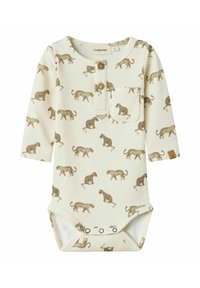 Långärmad klämdress i krämfärgad ribbad tyg med brunt leopardm�önster, tryckknappar vid botten och en liten bröstficka med en träknapp.