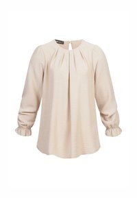 Blusa a maniche lunghe di un leggero beige con fronte plissettato, scollatura rotonda e polsini con balze. Tessuto morbido e testurizzato con una leggera lucentezza.