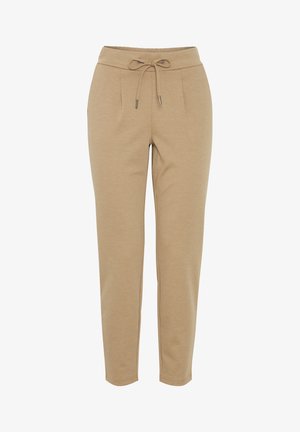 Beige jogger pants gemaakt van zachte stof. Voorzien van een elastische tailleband met een trekkoord, voorste plooien en taps toelopende pijpen.
