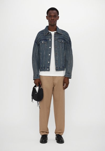 Holzweiler COCOON MICRO BAG UNISEX - Τσάντα χειρός - black washed