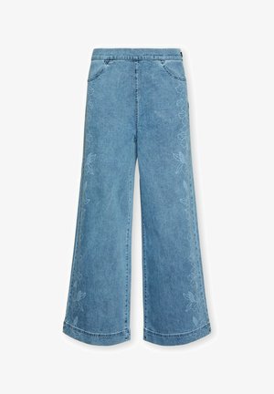 Jean large en denim bleu avec une broderie florale subtile le long des coutures extérieures et des poches avant.