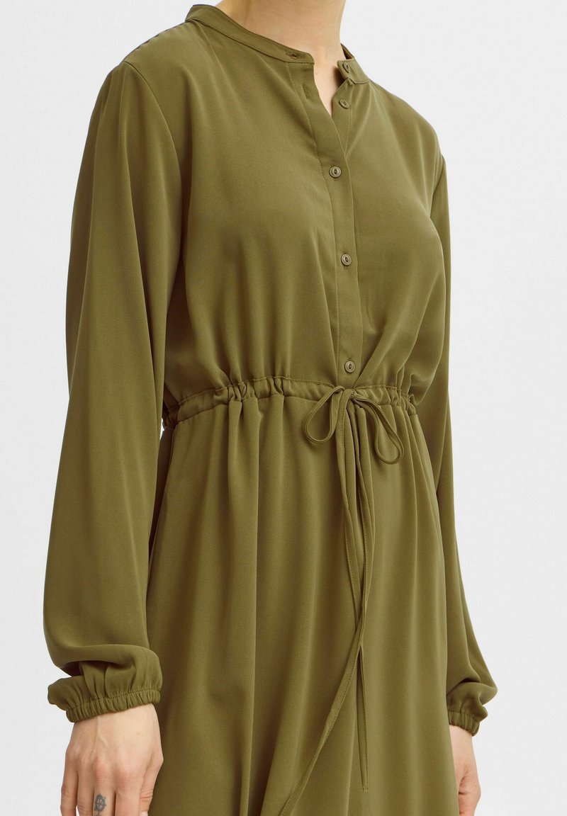 flowy summer wedding guest dresses FRAME Women's The Modern Utility Shirt | Military Green | Silk