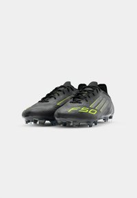 adidas Performance F50 ELITE FG - Chaussures de football pour terrain sec - core black/iron metallic/lucid lemon