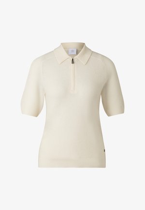 Short-sleeve polo sweater in cream, featuring a zip neckline and textured knit design. Ribbed hem and collar add structure.