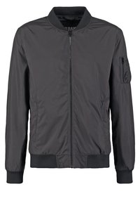 Black bomber jacket made of smooth nylon fabric, featuring a central zipper, ribbed cuffs, and a zippered pocket on the left sleeve.