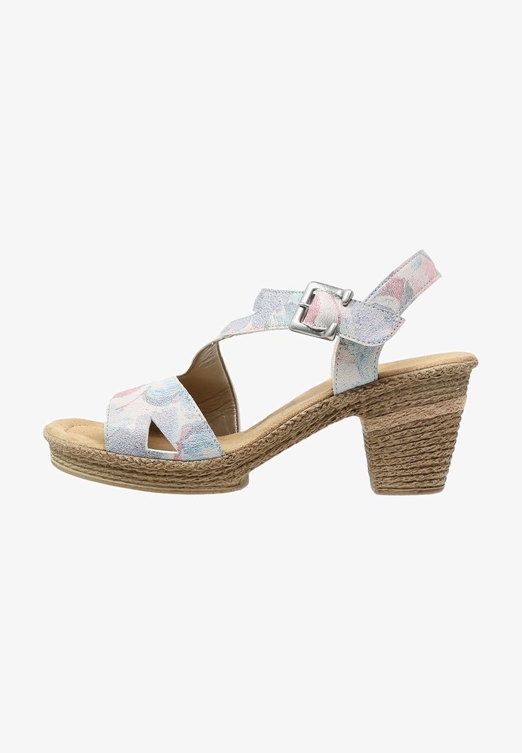 Korkokenkä, jossa on avonaiset varpaat, pastellivärinen kukkakuosi, hihna, säädettävä solki ja teksturoitu juuttikääreinen korko paremman pidon takaamiseksi.