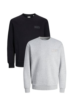 Two crewneck sweatshirts, one black and one light gray, made of soft fabric. Each features a small branded tag on the chest.