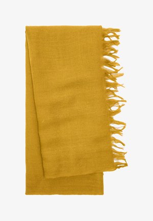 Musztardowy szal z postrzępionymi krawędziami, wykonany z miękkiego, teksturowanego materiału. Prostokątny kształt, lekki i wszechstronny w formie.