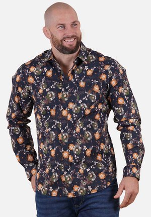 Chemise à manches longues pour homme en marine foncé avec un motif floral mettant en avant des accents orange et verts. Col boutonné et coupe régulière.