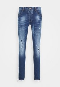 Slim-fit blå denimjeans med blekt tvätt, slitningar och färgstänk, med framfickor och knappstängning.