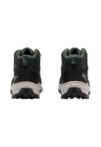 Scarpe da trekking nere e verde scuro con colletto imbottito, tomaia in rete testurizzata e suola in gomma robusta. Tallone rinforzato e dettagli riflettenti.