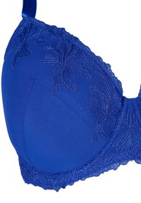 Blue bra with padded cups. Floral embroidery along the upper edge and lace trim. Adjustable straps and smooth fabric texture.