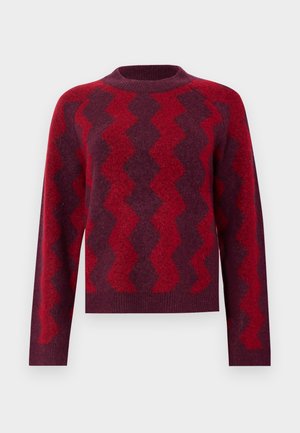 Sötétvörös kötött pulóver világosvörös, kontrasztos zig-zag mintákkal. Kerek nyakú és hosszú ujjú, puha anyagból készült.