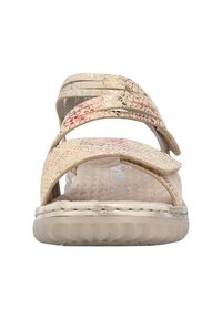 Beżowe sandały z teksturowanymi paskami, z lekkimi metalicznymi akcentami i wyściełaną podeszwą. Regulowane zapięcie na rzep zapewniające dopasowanie.