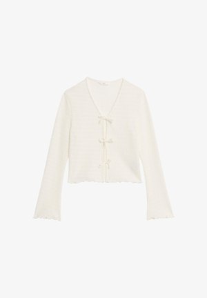 White cropped cardigan with long sleeves, featuring a textured fabric, V-neckline, and laces with bows at the front; scalloped hem.
