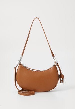 Brown leather handbag with a crescent shape, zipper closure, and silver hardware. Features a detachable strap and an accent tag.