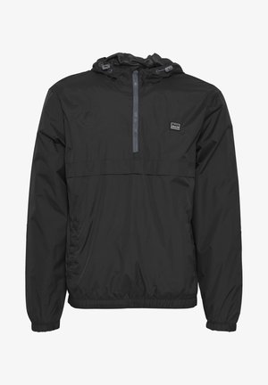 Must värvi kerge tuulekraam, millel on kapuuts, elastsed mansetid ja vöökoht. Omab pooltõmblukk ees ning logo rinnal. Veekindel materjal.