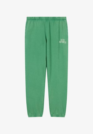 Pantalones deportivos verdes con cintura elástica, puños elásticos y texto blanco "Pacífico Noroeste" en la parte superior del muslo izquierdo.