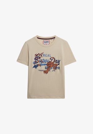 T-shirt en coton beige à col rond, avec un design graphique coloré d'un tigre et du texte, à manches courtes et à coupe décontractée.