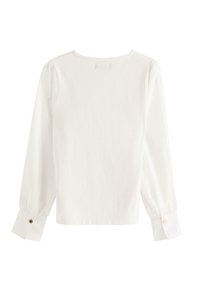 Blusa bianca a maniche lunghe con scollo rotondo, maniche a sbuffo e polsini con bottoni. Tessuto di cotone morbido con un design pulito e semplice.