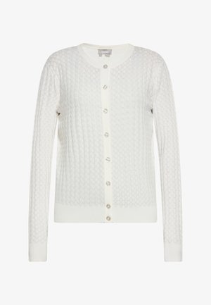 Bela pletena jopica z teksturiranim diamantom, okroglim ovratnikom in bisernimi gumbi spredaj. Ribočasti manšeti in rob.