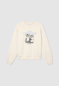 Felpa color crema con collo rotondo e maniche lunghe, caratterizzata da una grafica stampata di due gattini e dal testo "Coordinatori del Caos".