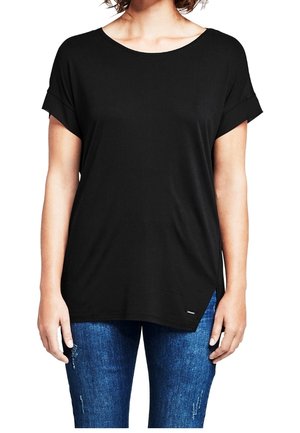 Black short-sleeve t-shirt with a wide neckline, relaxed fit, and side slit. Soft fabric with a smooth texture, paired with blue distressed jeans.