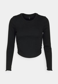 Černý dlouhý rukáv zkrácený top vyrobený z žebrované tkaniny. Má kulatý výstřih a volánkové detaily na zakončení rukávů.