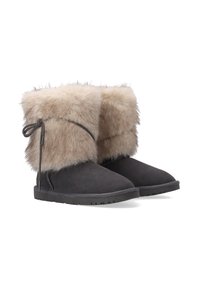 Schwarze Wildlederstiefel mit einem flauschigen beigen Fellaufschlag, der seitlich mit einem passenden Kordelband gebunden ist, ausgestattet mit einer flachen Gummisohle und einer abgerundeten Zehe.