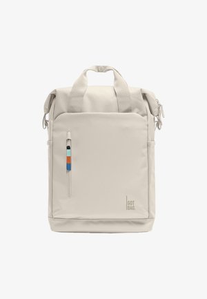 Beige rectangular backpack with top handles, front zip pocket with colored pull tab, and "GOT BAG" logo at bottom right.