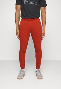Nike Performance TAPER - Træningsbukser - rugged orange black