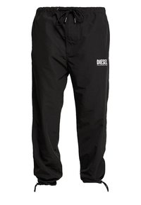 Black, nylon jogger pants with an elastic waistband and drawstring, featuring a white "DIESEL" logo on the left thigh. Elastic cuffs at ankles.