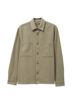 Camicia khaki con bottoni, colletto, due tasche anteriori a toppa e maniche lunghe. Realizzata in tessuto testurizzato con vestibilità comoda.