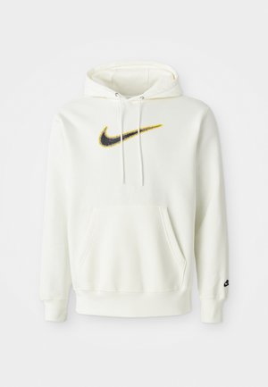 White cotton hoodie with a front pocket, featuring a black and yellow Nike logo. It has a drawstring hood and ribbed cuffs and hem.