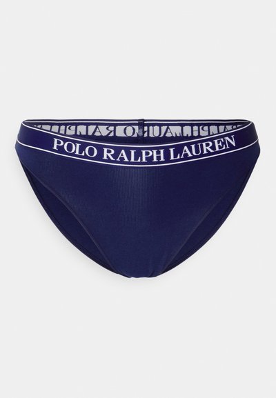 Tumedat sinine bikiini aluspüksid pehme tekstuuriga, millel on valge elastne vöökoht, millel on kiri "POLO RALPH LAUREN".