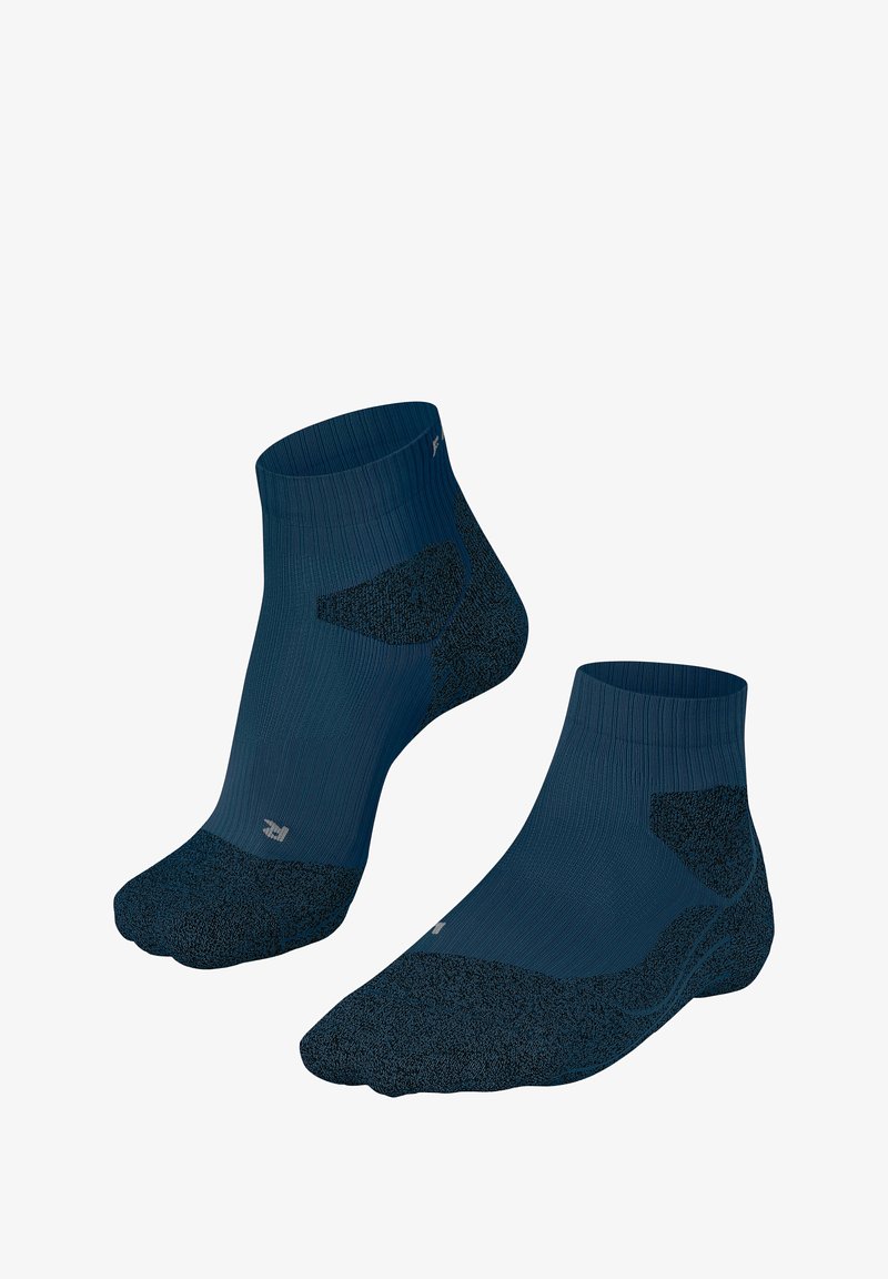 Enkelsokken in donkerblauw met een geribbelde textuur en versterkte tenen en hielen. Inclusief een gevoerd gedeelte voor comfort.