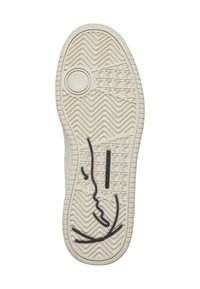 Sole obuvi s texturovanými drážkami a zigzagovými vzory, s vloženým kulatým logem a designem černé akcentní linie. Světle béžová barva.