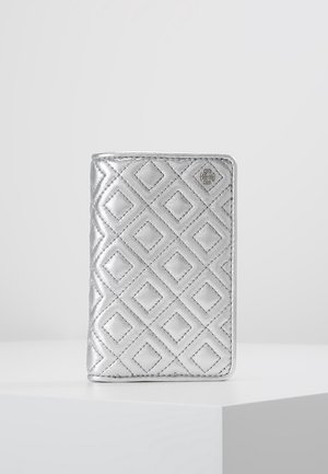 Silver quilted wallet with diamond stitching pattern and small logo embossed in the upper right corner, standing upright on a white surface.