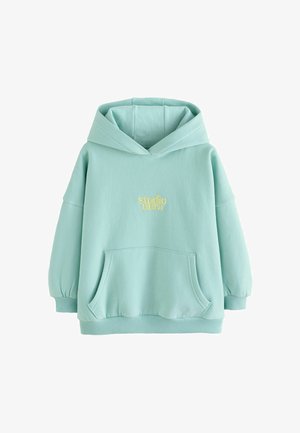 Mintgrön hoodie i mjukt tyg, med en framficka, ribbad mudd och broderad "studio aura"-logotyp i gult.