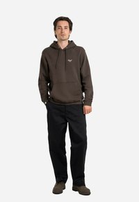 Brown hooded sweatshirt with a front pocket, black trousers, and brown shoes. Simple design with adjustable drawstring, no visible patterns.