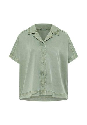 Chemise courte à manches courtes vert clair avec boutons, col et détails de couture visibles sur les épaules et l'ourlet.
