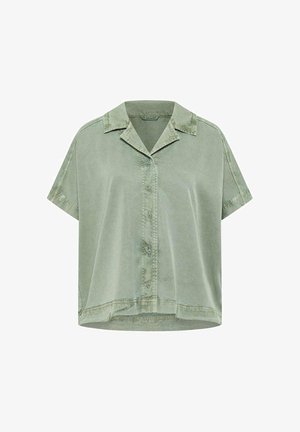 Chemise courte à manches courtes vert clair avec boutons, col et détails de couture visibles sur les épaules et l'ourlet.