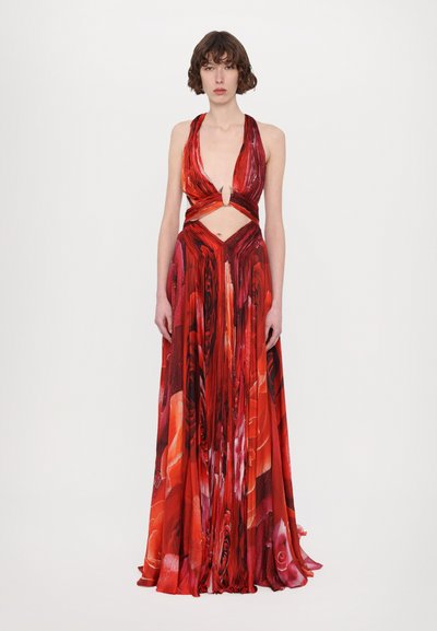 Red floral halter dress featuring a deep V-neck, cut-out waist, and flowing skirt with vertical pleats. Made of lightweight, textured fabric.
