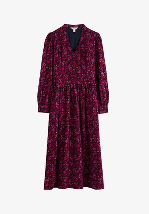 Vestido de flores de manga larga con escote en V, cintura ceñida y falda fluida, con un patrón de hojas en rosa, púrpura y naranja sobre un fondo oscuro.
