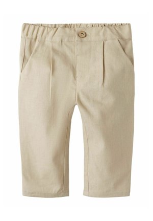 Beige Baumwollhose mit elastischem Bund, vorderen Bügelfalten und einem einzelnen Holzknopf. Mit Seitentaschen und geraden Hosenbeinen.