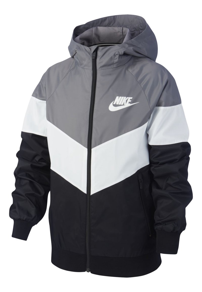 Nike bunda s kapucí, barevně členěná v šedé, bílé a černé, s předním zipem a elastickými manžetami. Výrazný detail loga.