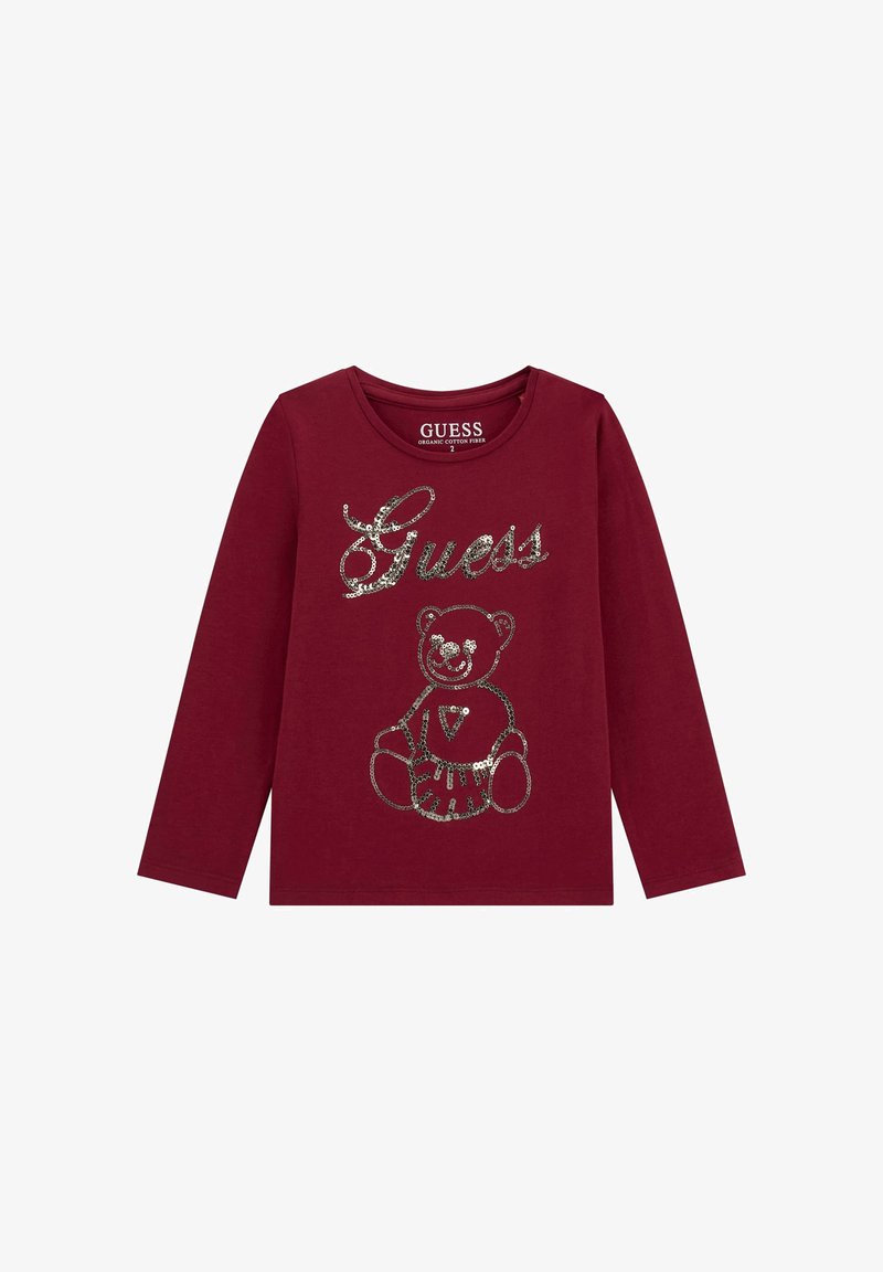 Camicia a maniche lunghe bordeaux con logo "Guess" in paillettes argentate e design di orsacchiotto sul davanti, realizzata in fibra di cotone biologico.