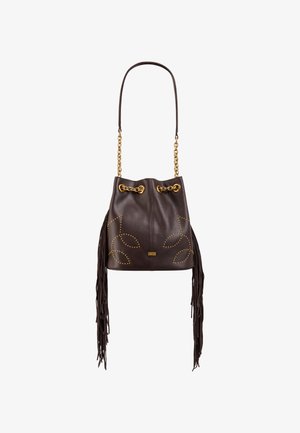 Brown leather bucket bag with gold hardware, chain strap, and fringe detailing. Features studded leaf patterns and a drawstring closure.