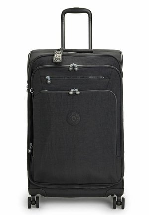 Black soft-sided suitcase with multiple zippered pockets, telescoping handle, four wheels, and a textured finish. Features logo on front.