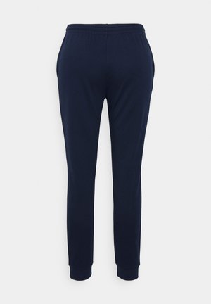 Mørkeblå joggebukser med elastisk midje og smale ben. Stoffet ser glatt og mykt ut, med ankelmanchetter.